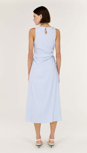 Back view of the Baby Blue Cotton Textured Cut Out Midi Dress showcasing its elegant design and comfortable fit.