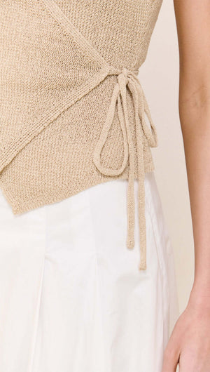 Beige V-neck Wrap Knit Top showcasing its adjustable tie detailing and refined knit texture.