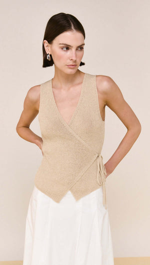 Beige V-neck Wrap Knit Top styled elegantly on a model with a flattering wrap silhouette and sleeveless design.