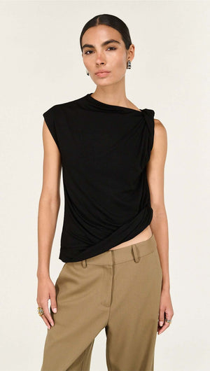 Model wearing a Black Twist Asymmetric Tank, showcasing its elegant twist detail and modern silhouette.