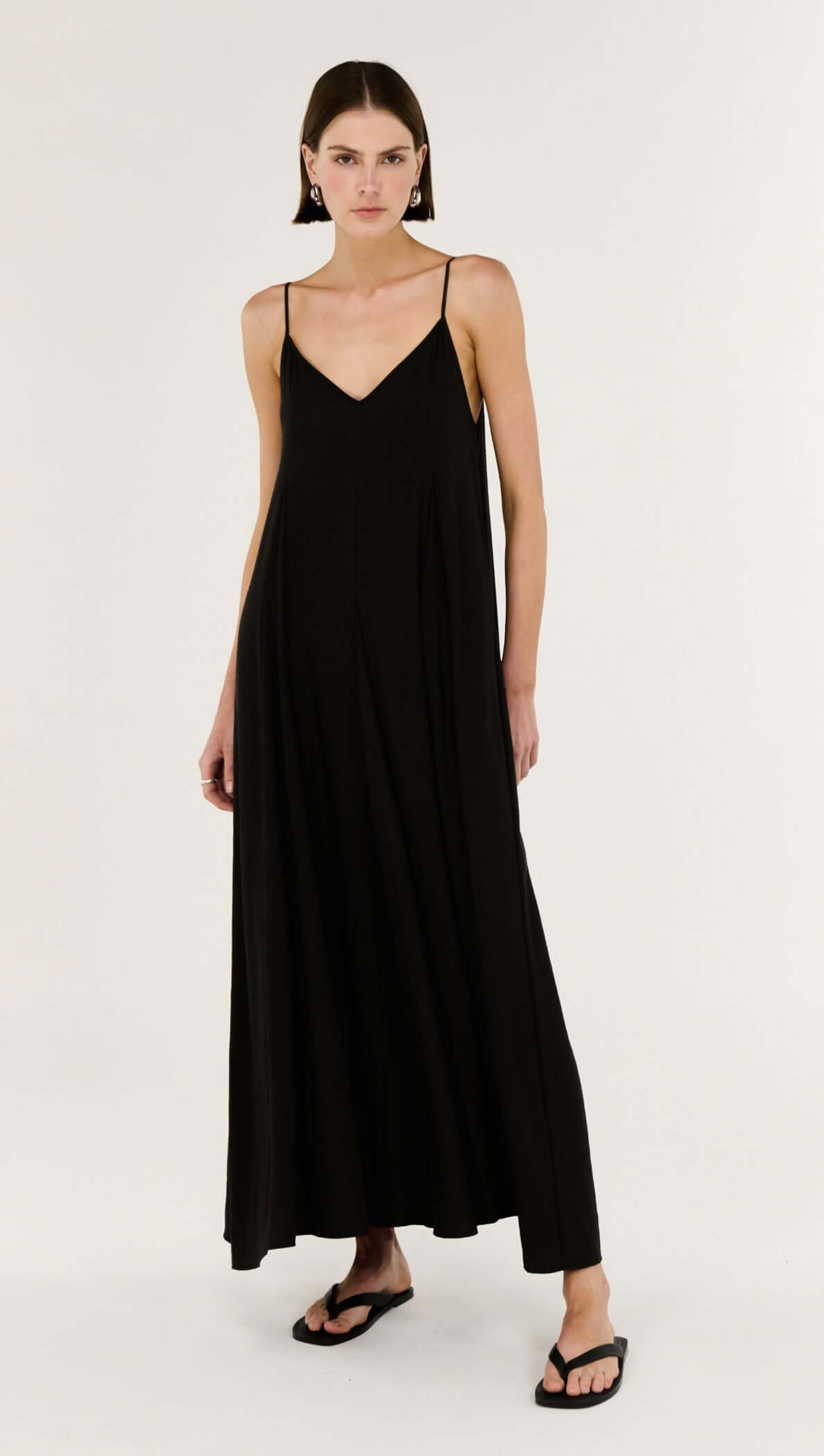 Model wearing the Black V-Neck Floaty Maxi Dress, showcasing its elegant silhouette and fluid drape.