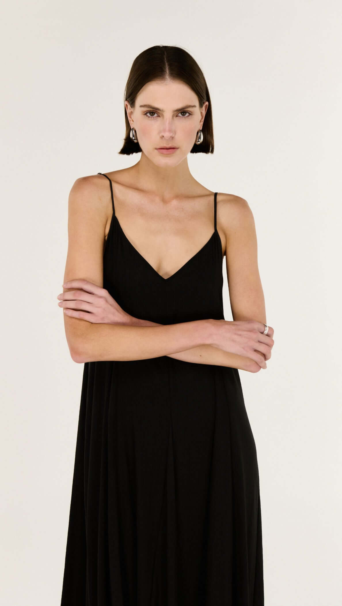 Model wearing the Black V-Neck Floaty Maxi Dress, showcasing its elegant silhouette and fluid drape.