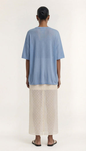 Model wearing a Blue Round Neck Oversized Knit Tee with dropped shoulders and elbow-length sleeves.