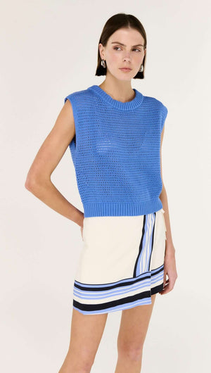Blue Wide Gauge Cotton Blend Knit Tank styled with a chic skirt, showcasing its modern design and bold cobalt color.