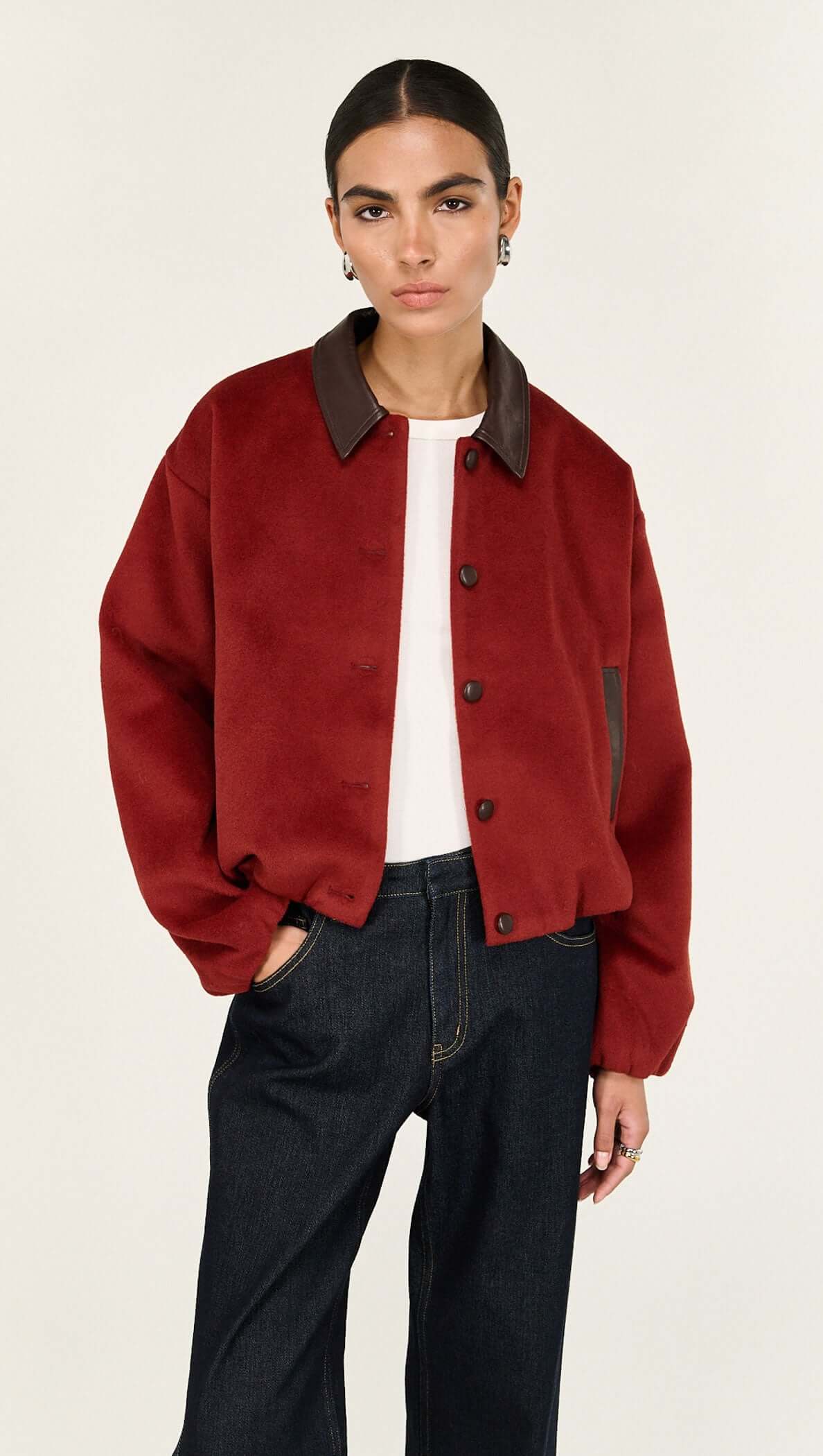 Model wearing a Burgundy Brushed Bomber Jacket with a vegan leather collar and snap-button front.