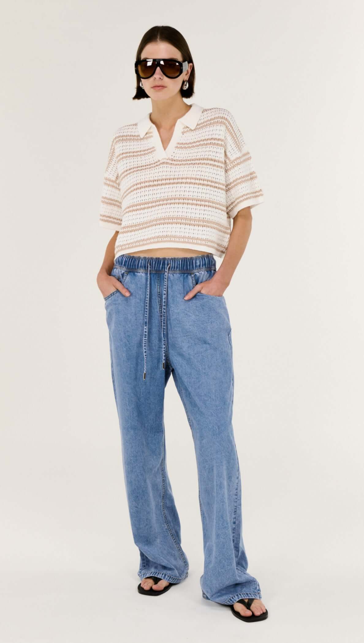 Model showcasing Chambray Lightweight Elasticated Denim Pants with an elastic waistband and relaxed fit.