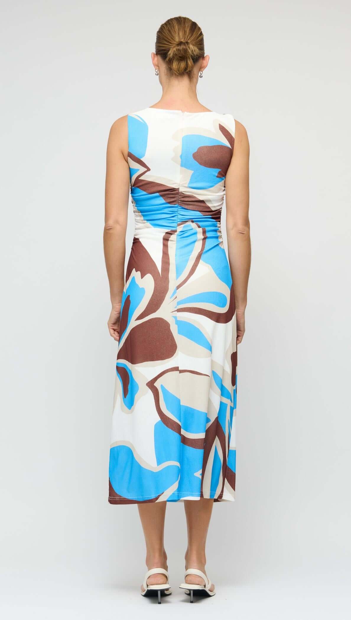 Back view of the Blue Abstract Mesh Midi Dress showcasing its abstract print and figure-skimming silhouette.