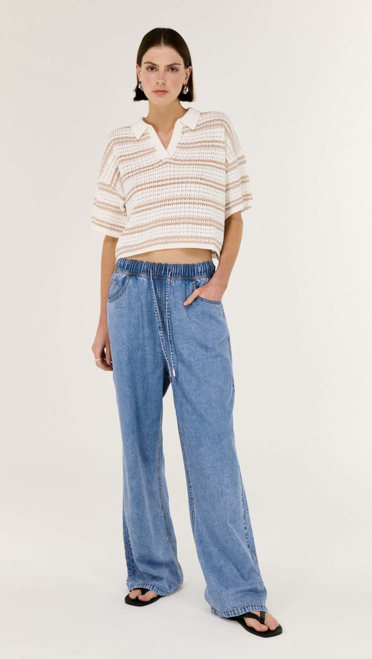 Cotton Blend Stripe Knit Polo displayed on a model, featuring a cropped length and soft open-knit texture.