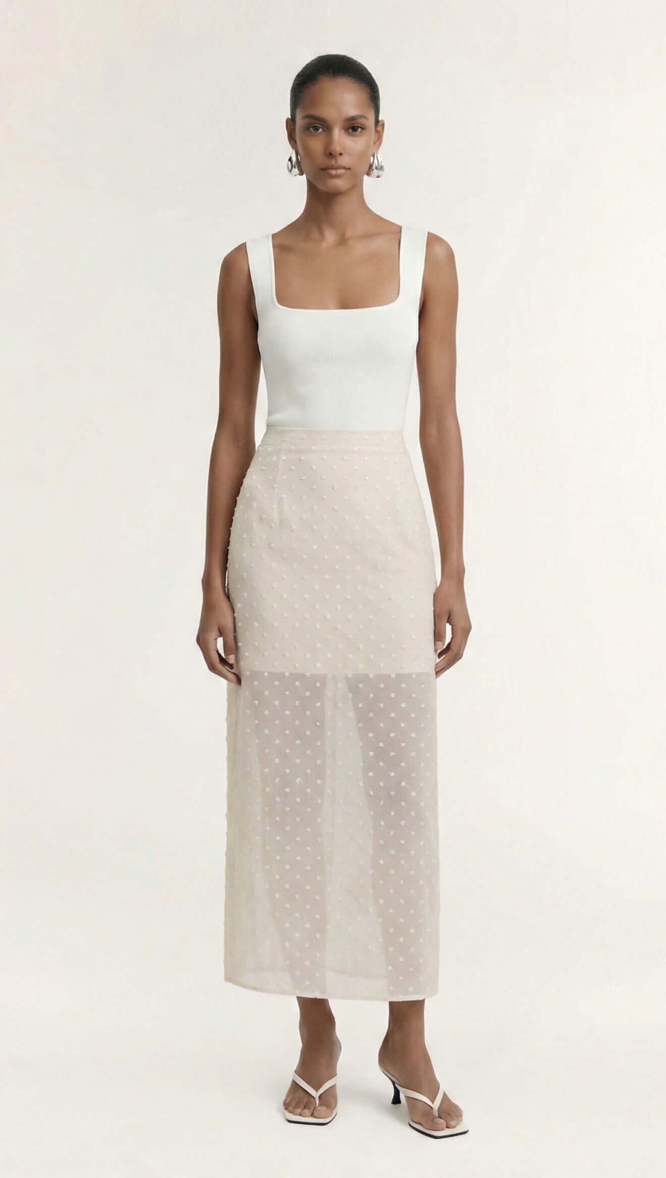 Cream Embroidered Spot Sheer Layered Midi Skirt styled with a fitted tank and strappy heels.
