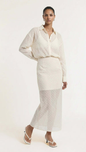 Cream Embroidered Spot Sheer Layered Midi Skirt styled with a sheer blouse, showcasing a fashionable look.