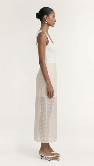 Cream Embroidered Spot Sheer Layered Midi Skirt modeled from the side, showcasing its lightweight sheer fabric and elegant silhouette.