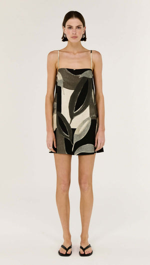 Model wearing the Dark Leaf Shift Mini Dress with a relaxed trapeze silhouette and statement Leaf Garden print.