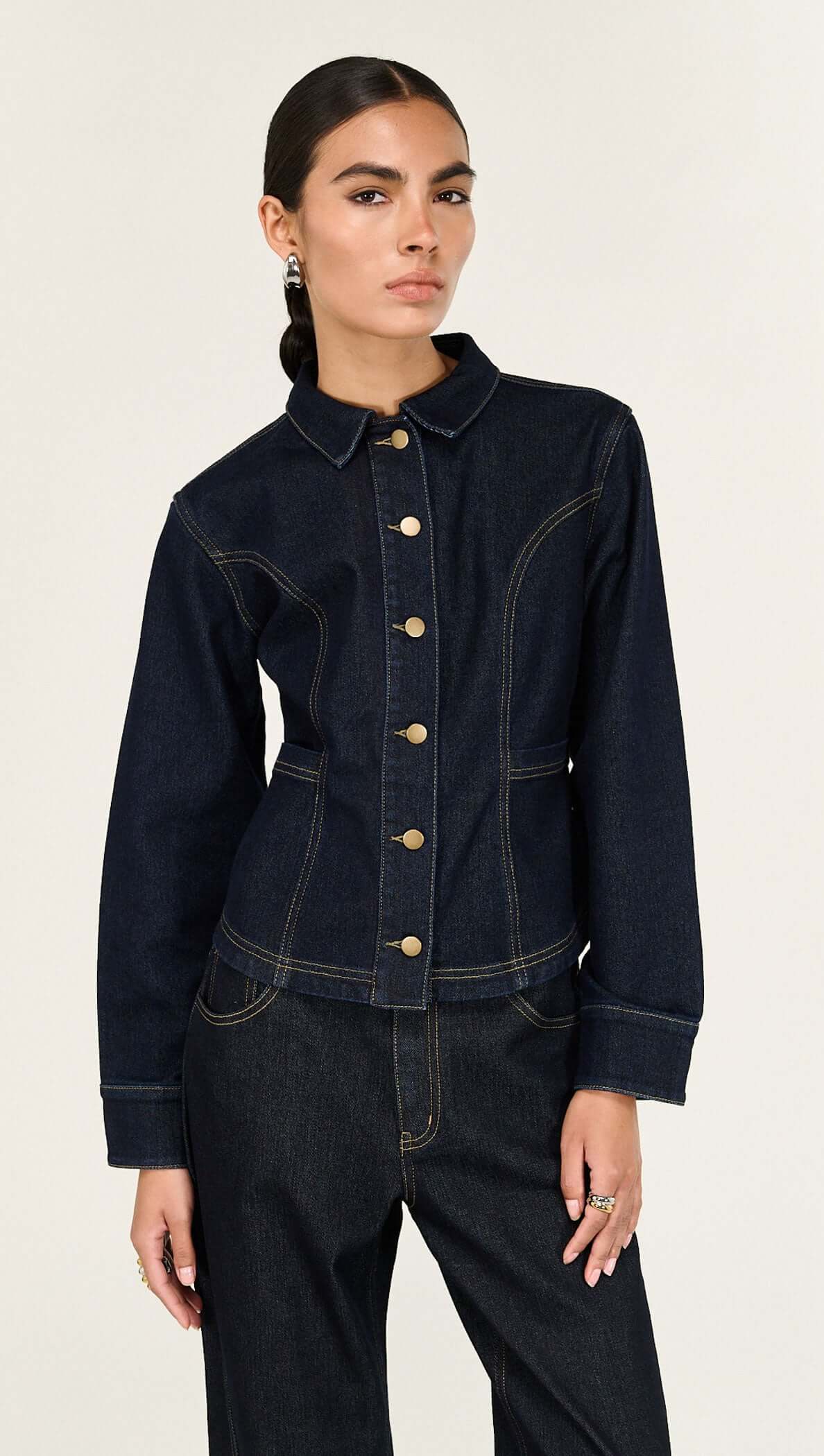 Aalto Dark Wash Fitted Denim Shirt Jacket featuring sculptural paneling and clean tailoring, styled for a refined look.