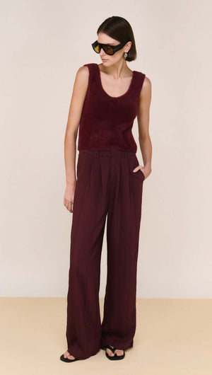 Model wearing a Deep Red Textured Wide-Leg Pant paired with a sleeveless top and sunglasses.