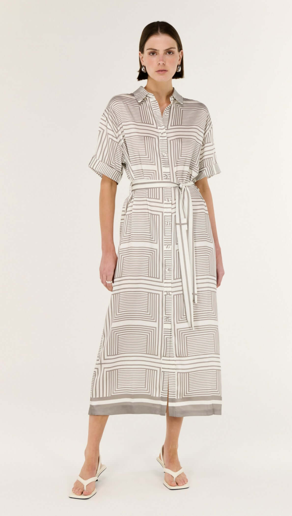 Model wearing the Geometric Print Button Front Midi Shirt Dress featuring a classic collar and waist-cinching tie belt.