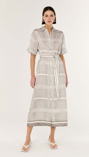 Model wearing the Geometric Print Button Front Midi Shirt Dress featuring a classic collar and waist-cinching tie belt.