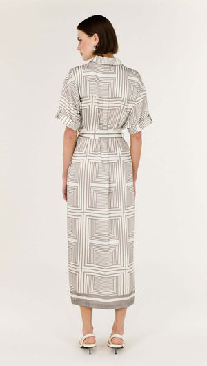 Back view of the Geometric Print Button Front Midi Shirt Dress showcasing the geometric stripe design and waist-cinching tie belt.
