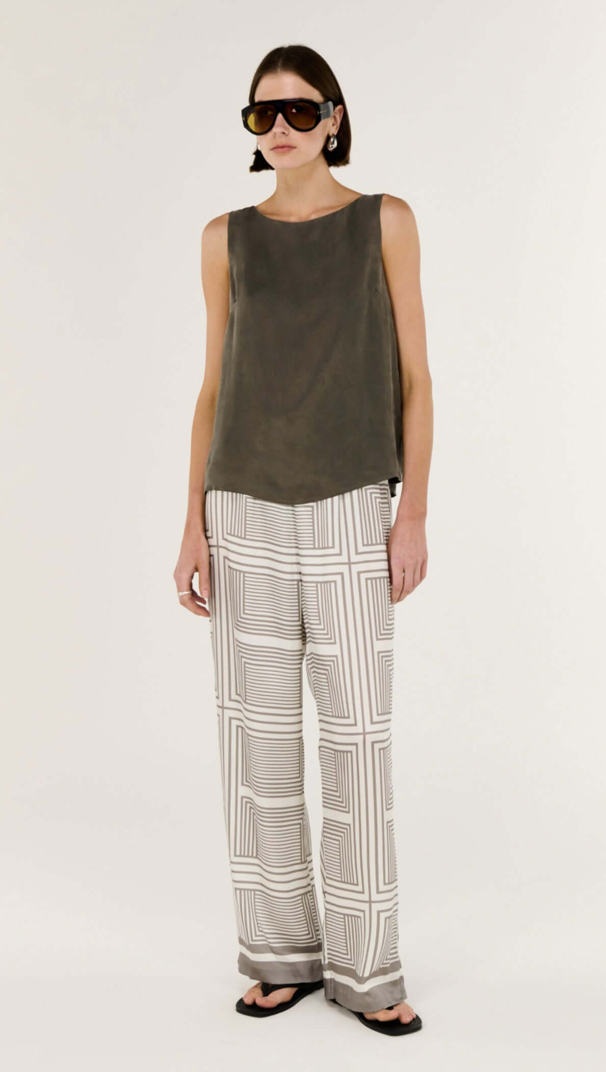 Geometric Print Relaxed Wide-Leg Low Rise Pant styled with a coordinating top and fashionable sunglasses.