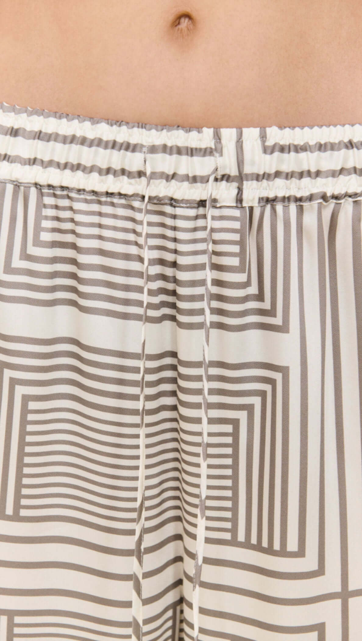 Geometric Print Relaxed Wide-Leg Low Rise Pant styled with a coordinating top and fashionable sunglasses.