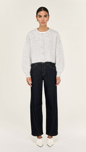 Grey Marle Cropped Knit Cardigan paired with dark high-waisted jeans, showcasing a modern layered look.