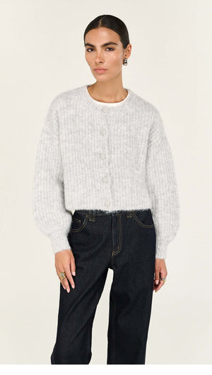 Grey Marle Cropped Knit Cardigan worn with dark jeans, featuring cropped hem and tonal buttons, ideal for layering.