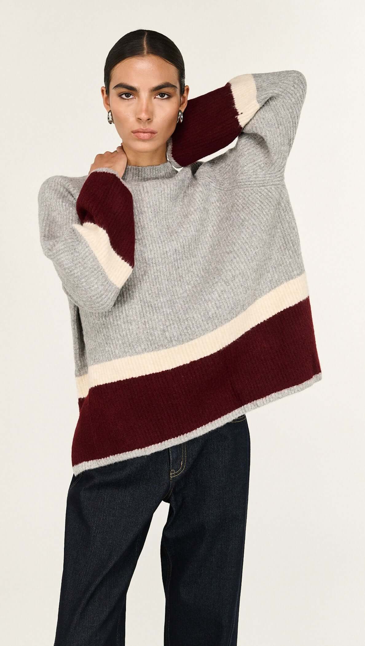 Grey Raglan Heavy Knit Jumper featuring bold color block bands and a relaxed fit, perfect for a modern wardrobe.