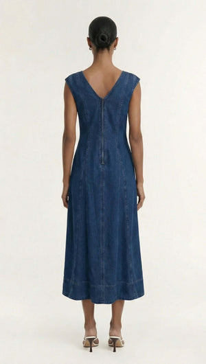 Back view of the Indigo Chambray Panelled Midi Dress showcasing its fitted silhouette and cap sleeves.