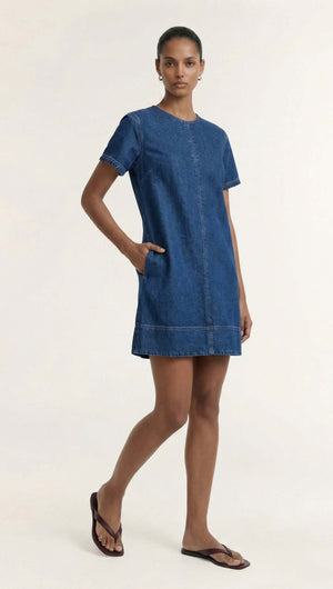 Indigo Chambray Short Sleeve Mini Dress on a model, featuring a round neckline and short sleeves, perfect for everyday wear.