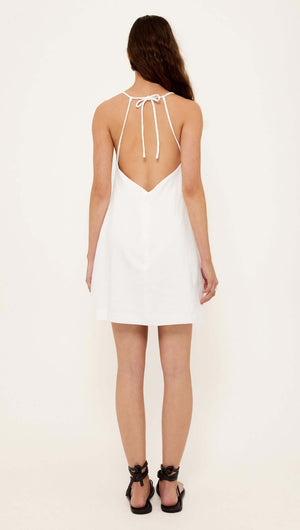 Linen Cotton Blend White Mini Dress featuring an open back and adjustable tie-back straps.
