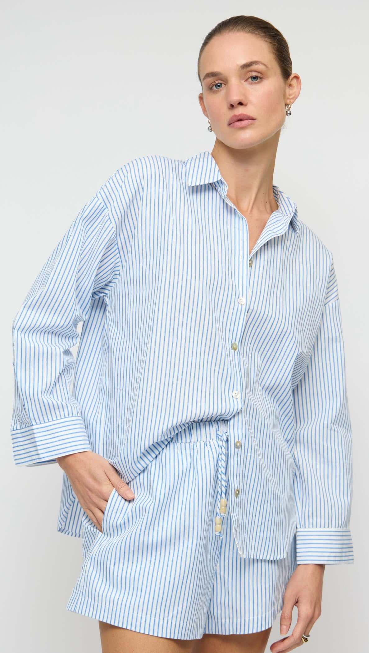 Cotton Blue & White Drawstring Shorts featuring a relaxed fit and side pockets, model wearing a matching top.