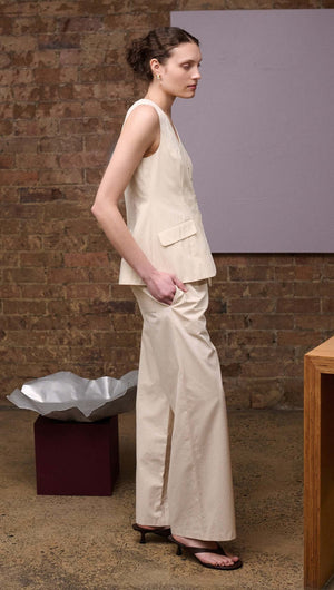 Model wearing Stone Cotton Wide Leg Drawstring Pant in a neutral hue, showcasing relaxed summer style.