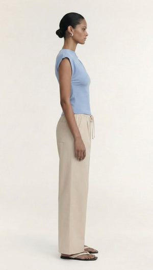 Model wearing Stone Cotton Wide Leg Drawstring Pant in a neutral hue, showcasing relaxed summer style.