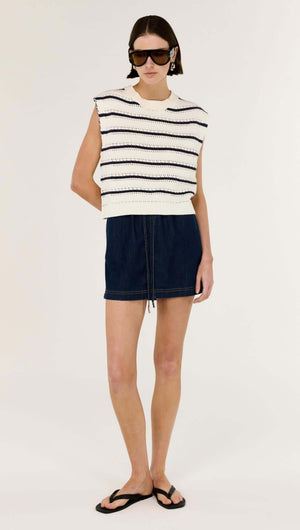 Striped Cotton Blend Knit Tank worn with denim skirt, showcasing classic stripe detailing and a modern silhouette.