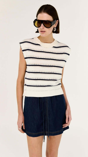 Model wearing a Striped Cotton Blend Knit Tank with a sleeveless design and classic stripe pattern.