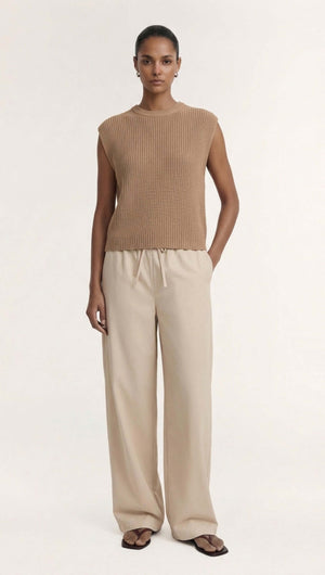 Elegant model wearing Taupe Cotton Blend Knit Tank Top paired with relaxed trousers, perfect for modern styling.