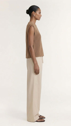 Taupe Cotton Blend Knit Tank Top showcased on a model wearing relaxed pants in a side profile view.