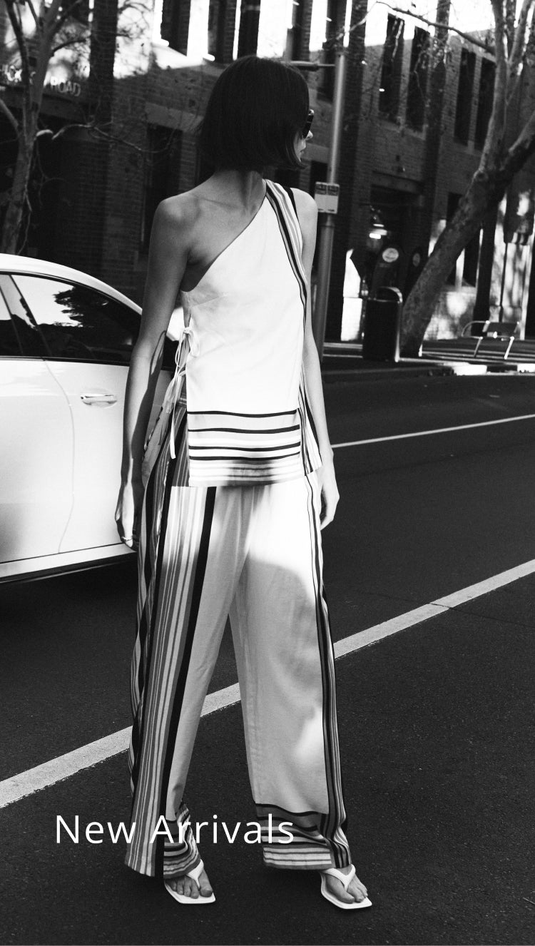 Person wearing a stylish outfit with 'New Arrivals' text overlay