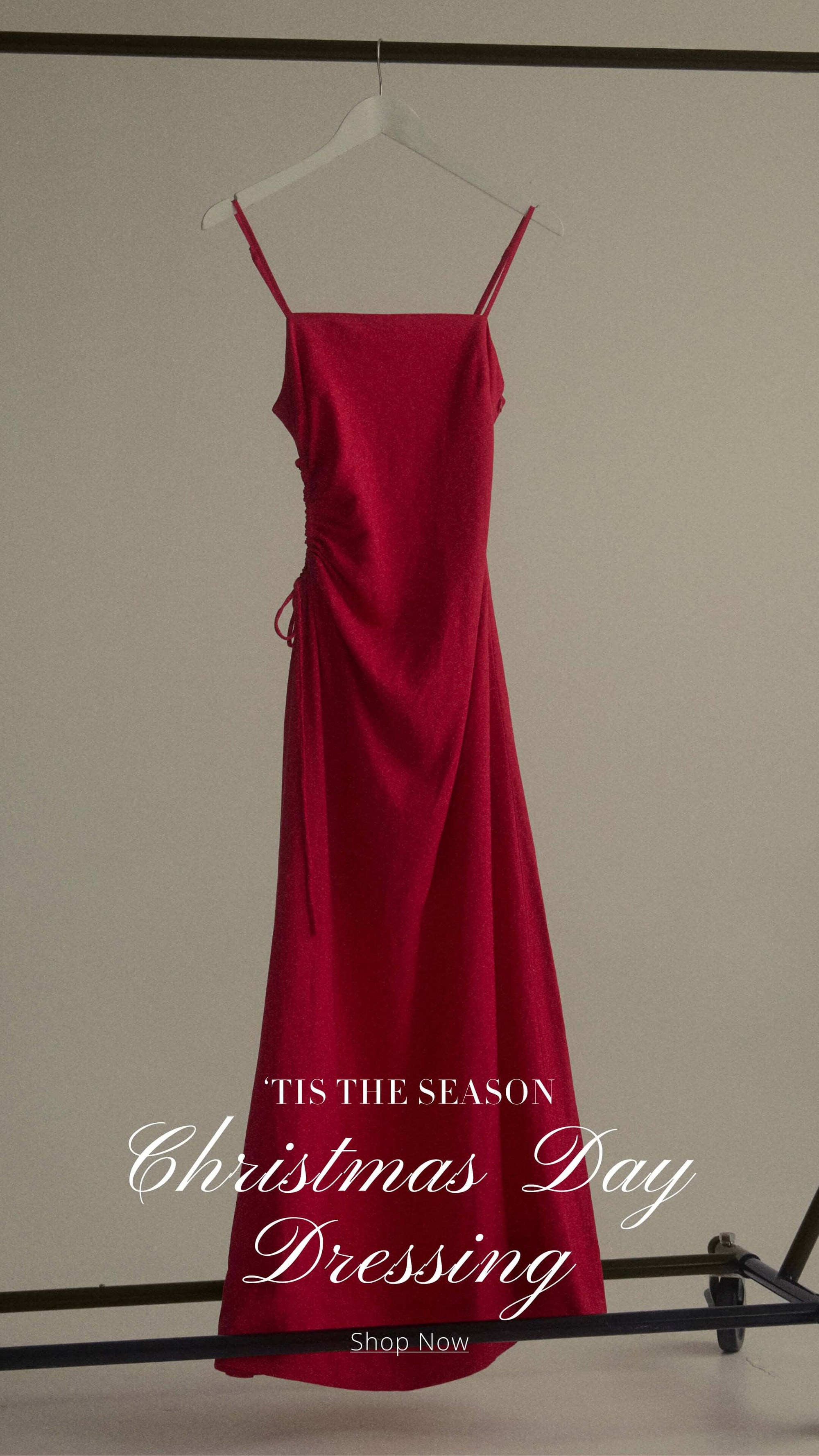 Elegant red dress for Christmas Day celebrations, featuring spaghetti straps and a flattering silhouette.