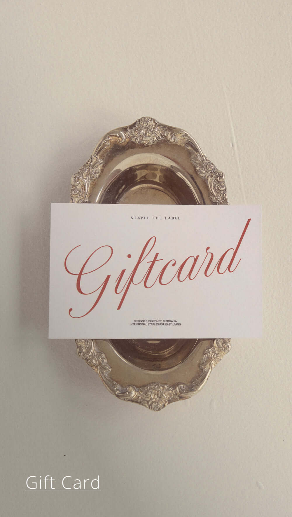 Elegant gift card displayed on a vintage silver tray, perfect for special occasions and gifting.
