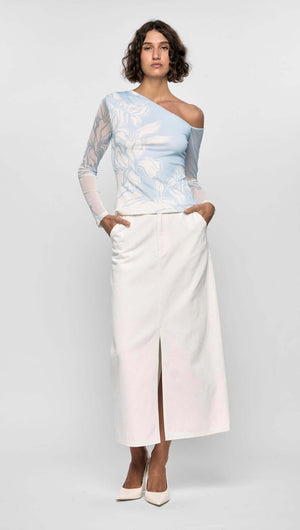 Model wearing the Aurora Mesh Top with asymmetric one-shoulder neckline, blue and ivory floral mesh, and long sheer sleeve.