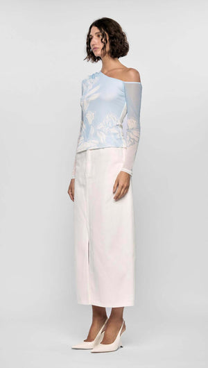 Model wearing the AURORA MESH TOP with asymmetrical one-shoulder design and long sheer sleeve in blue and ivory floral mesh.