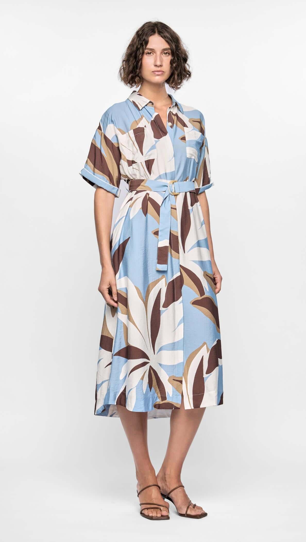 Maeve Midi Shirt Dress featuring a relaxed button-down silhouette with abstract blue, cream, and brown print, adjustable waist tie.