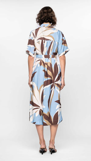Back view of Maeve Midi Shirt Dress with abstract brown, cream, and blue print, featuring cuffed sleeves and D-ring waist tie.