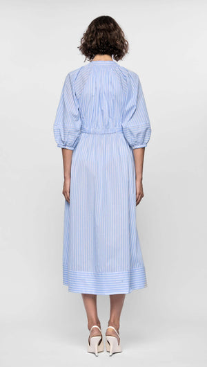 Back view of the Myra Midi Dress in soft blue stripes, featuring puff sleeves and a full skirt.