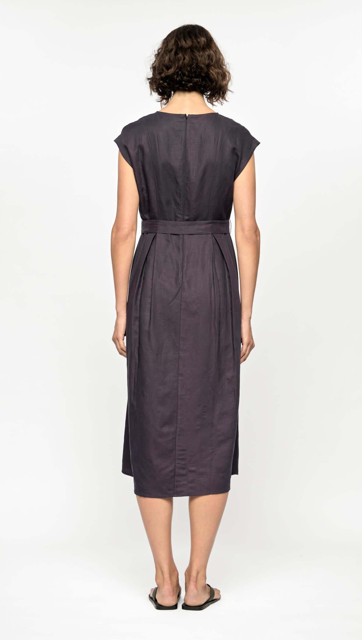 Back view of Rhea Midi Dress in deep navy, featuring cap sleeves and a self-tie belt, showcasing a breathable design.