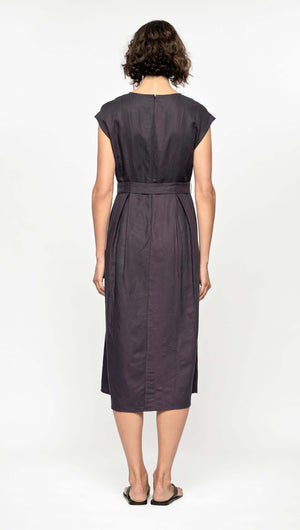 Back view of Rhea Midi Dress in deep navy, featuring cap sleeves and a self-tie belt, showcasing a breathable design.