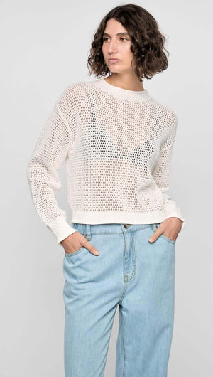 Off-white Oslo Knit Jumper in open-knit texture, featuring relaxed fit and ribbed trims, paired with light jeans.
