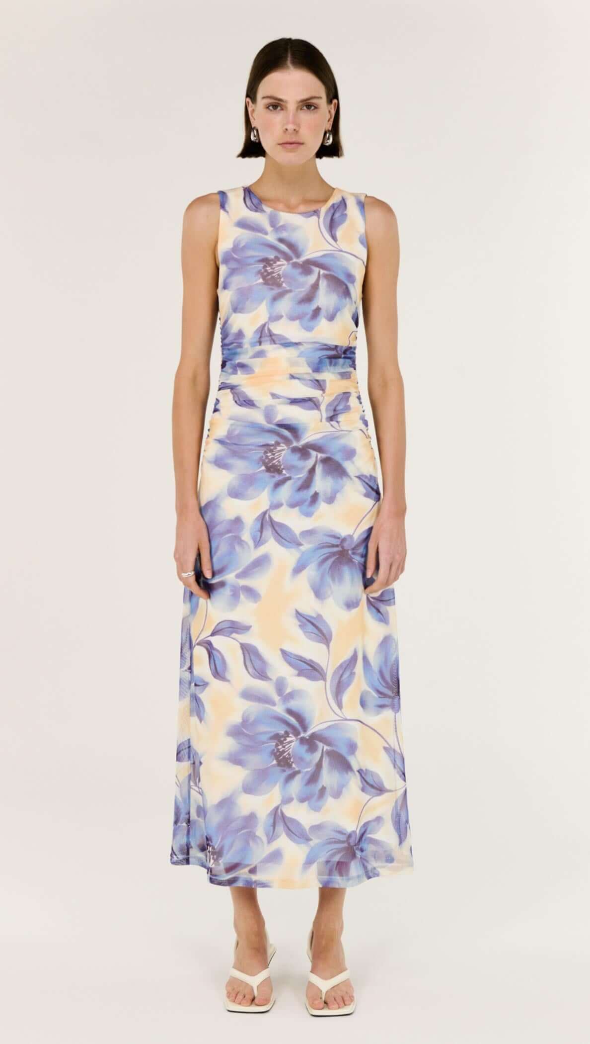 Blue Blurred Floral Mesh Midi Dress worn by a model, showcasing a flattering, soft floral print design.