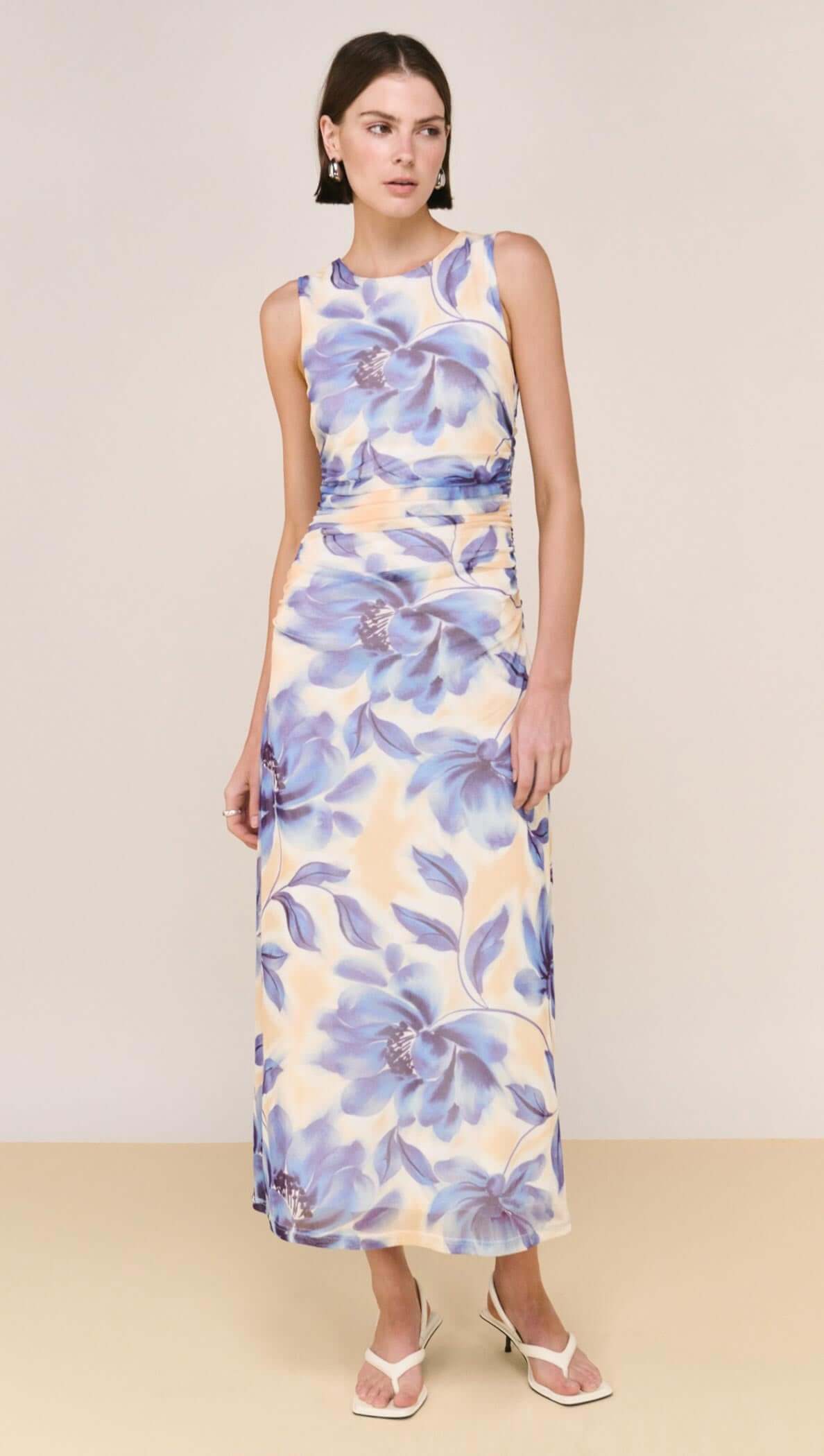 Blue Blurred Floral Mesh Midi Dress worn by a model, showcasing a flattering, soft floral print design.
