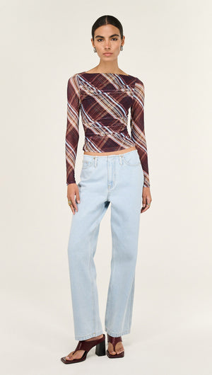 Plaid Mesh Boat Neck Top with Gather Detail styled with light wash jeans and heels, showcasing modern fashion.